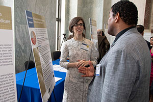 Lucy Leykum,MD, MBA, MSc (L) talks with a visitor to VA Research Day on the Hill. 