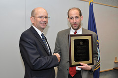 Dr. David Atkins congratulating Dr. Hayden Bosworth on being awarded the 2013 VA Under Secretary's Award for Outstanding Achievement in Health Services Research.