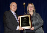 Robert A. Petzel, M.D., Under Secretary for Health, and Elizabeth Martin Yano, Ph.D., M.S.P.H., recipient of the 2012 Under Secretary's Award for Outstanding Achievement in Health Services Research.