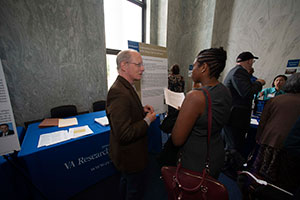 Mark Bauer, MD, PhD, (L) talking about implementing collaborative care for mental health at VA Research Day on the Hill.