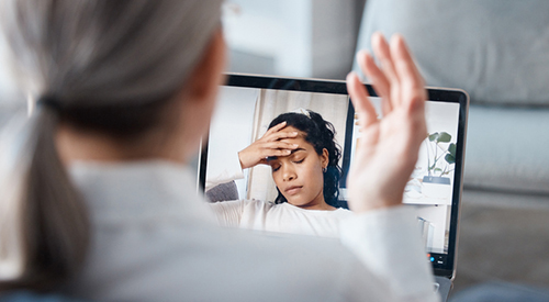 woman talking to a therapist online