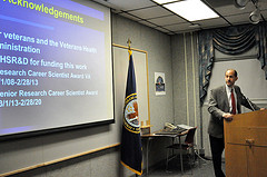 Dr. Hayden Bosworth giving a presentation of his journey helping Veteran outcomes.