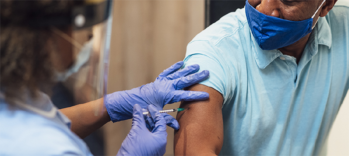 man getting vaccinated